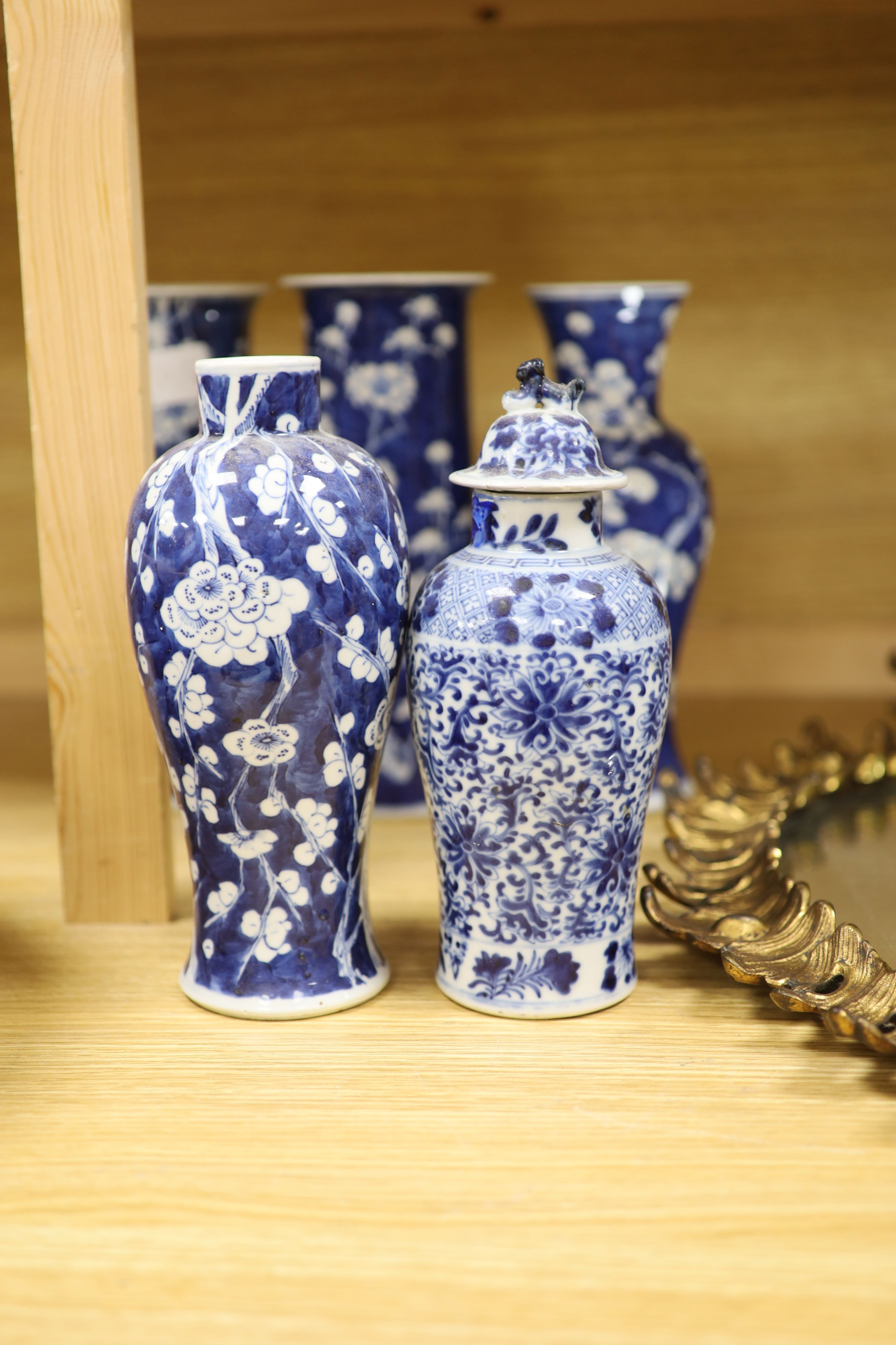 Four Chinese prunus pattern vases and a vase and cover, tallest 26.5cm